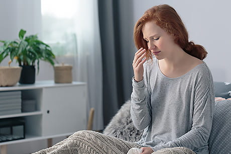 Woman at home recovering from sickness